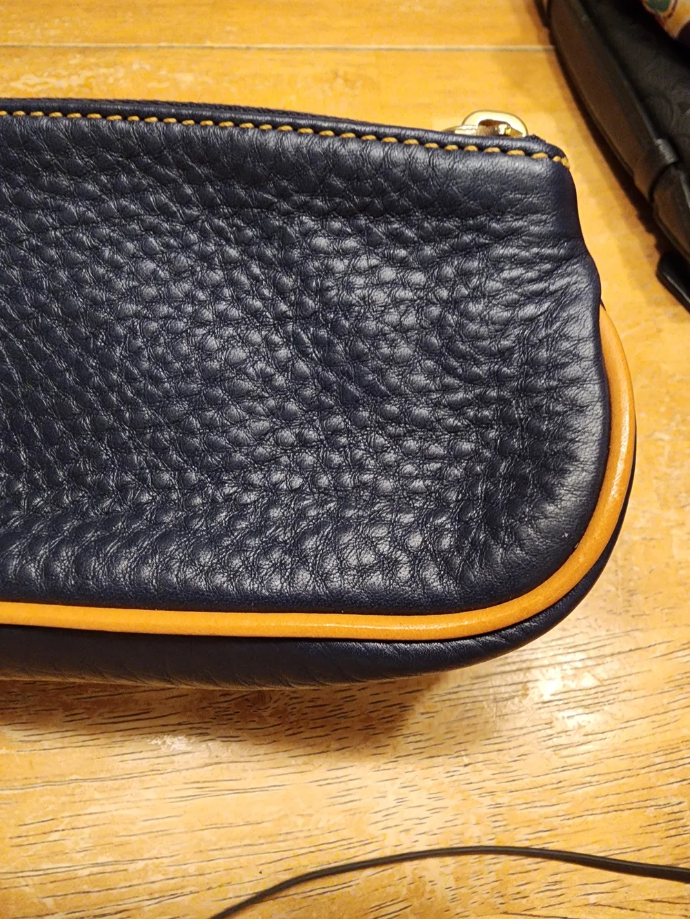 Dooney & Bourke Pebble Grain Slim Cosmetic slim pouch in navy blue Leather